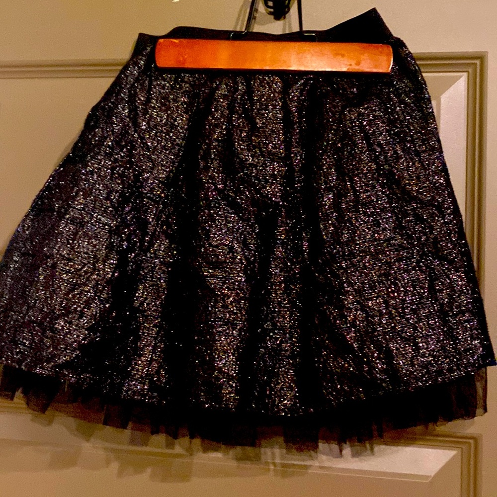 Beautiful shiny skirt with tool detail on the bottom
